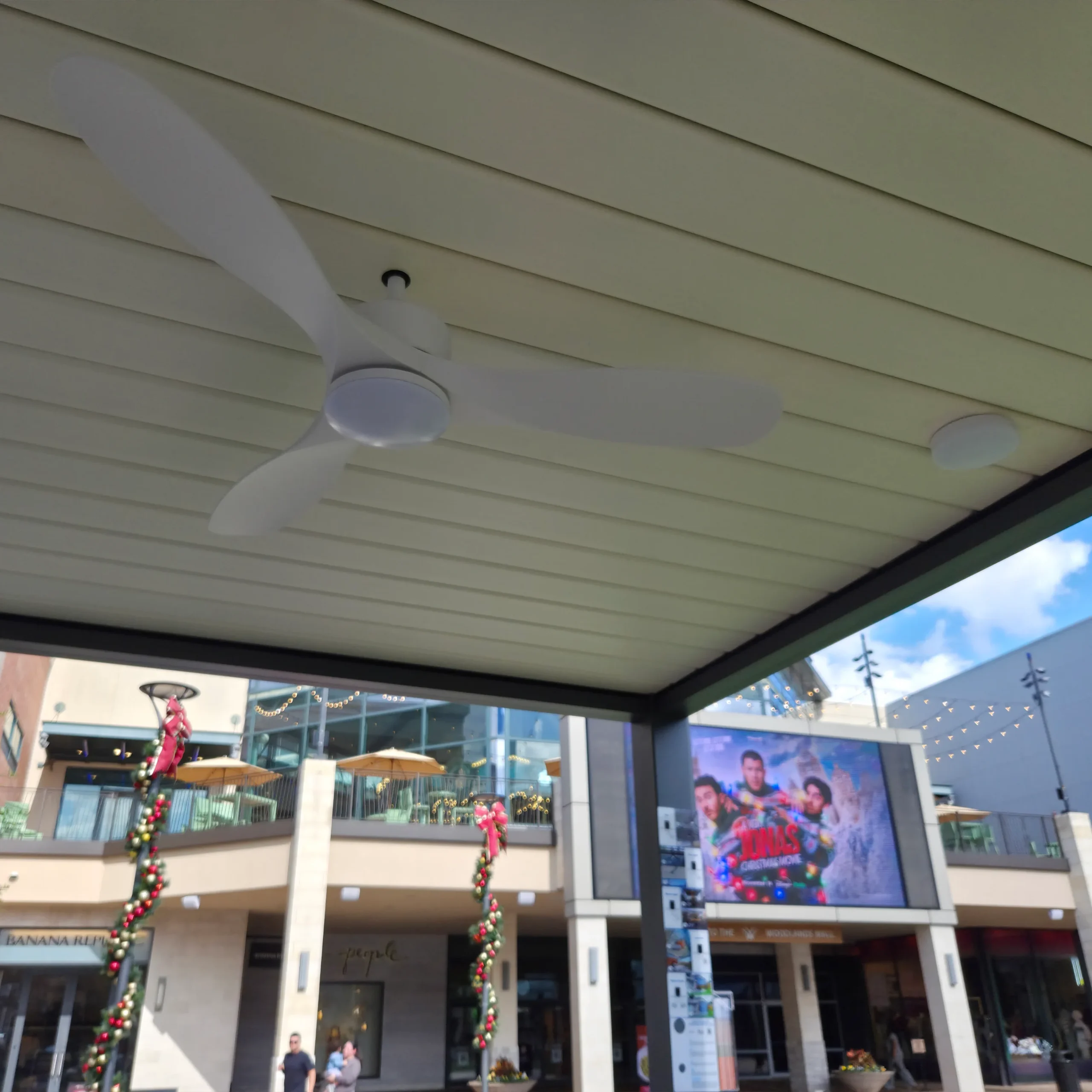 Built-in fan under a slatted outdoor awning