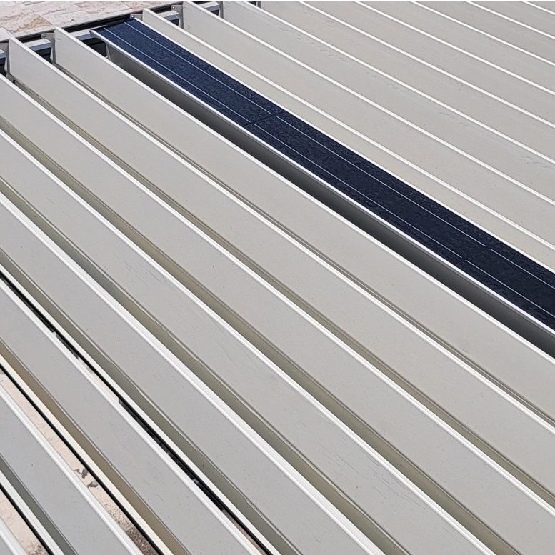 Solar panels are installed on the white louvers at the top of the pergola.