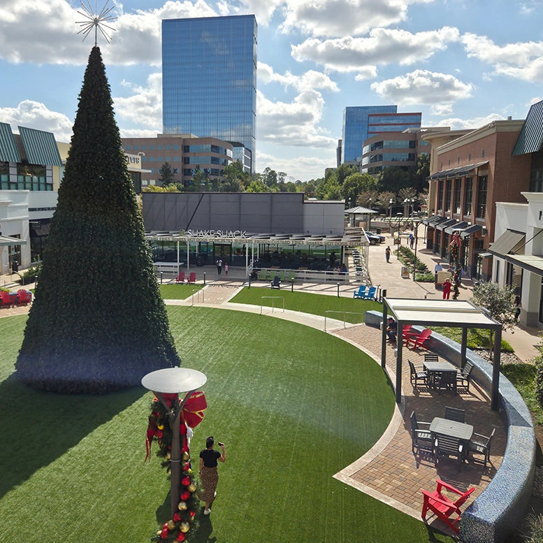 The modern motorized pergola complements the Christmas tree perfectly