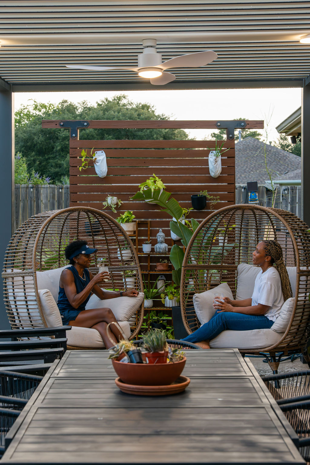 outdoor dining area under custom louvered pergola