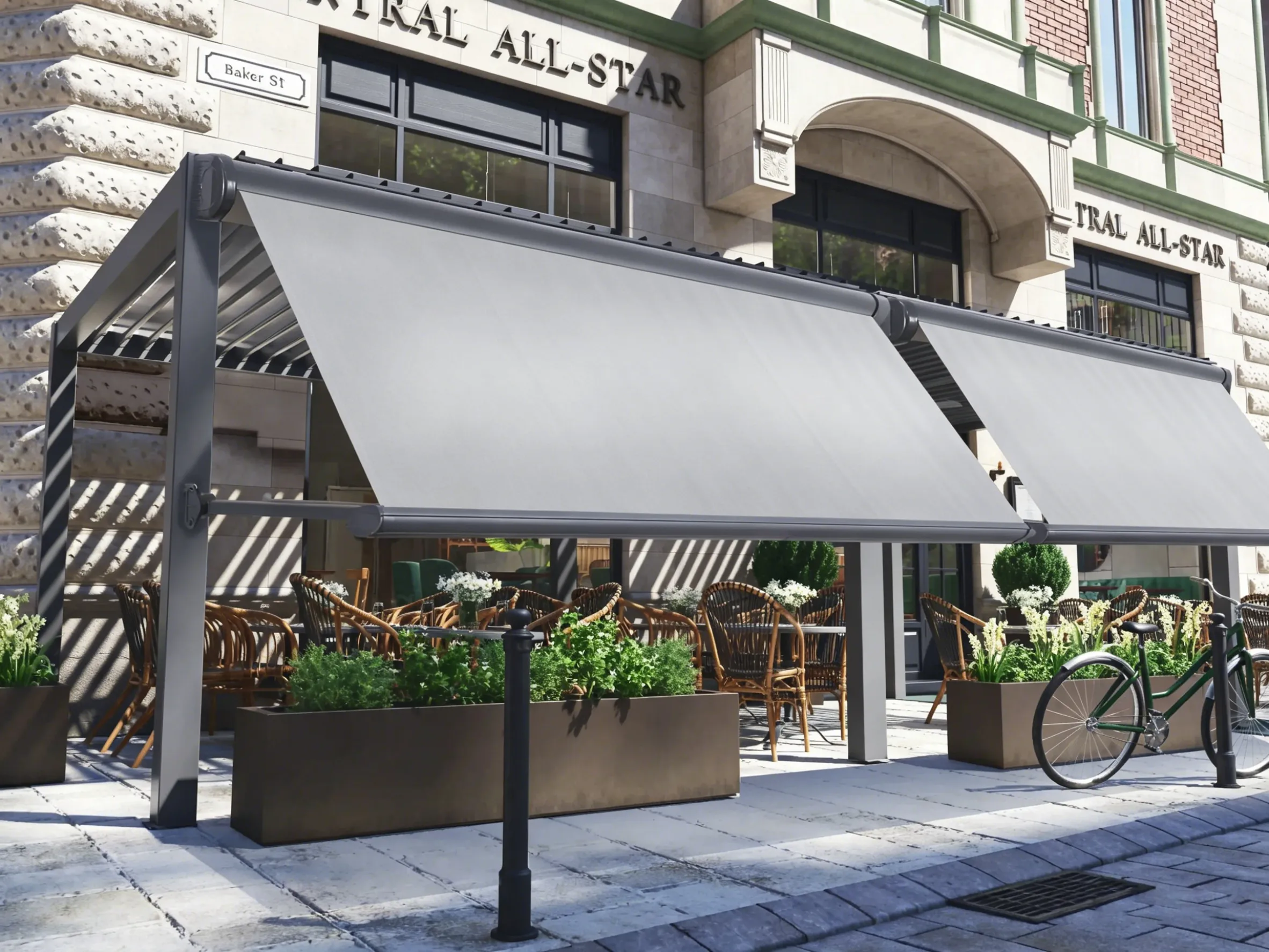 Gray drop arm awnings installed on a commercial pergola, shading outdoor café seating on a city street
